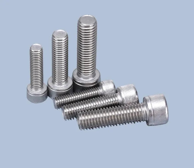 Stainless steel phono cartridge mounting kit with allen bolts, nuts, washers, and two allen keys on a white background.