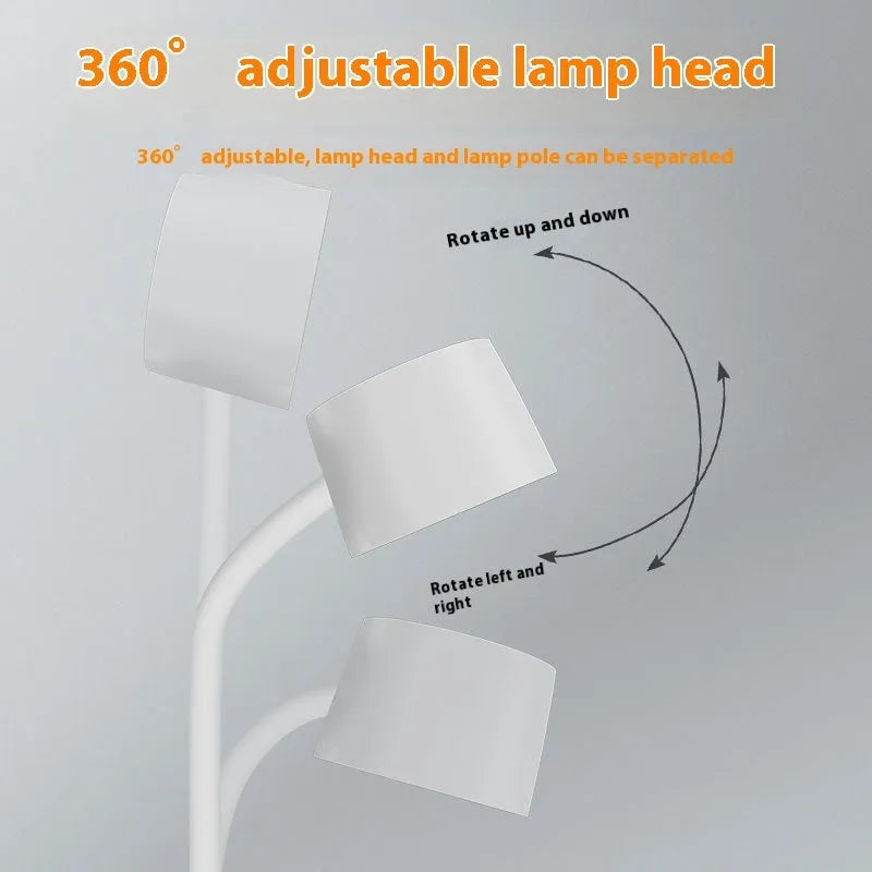 White and black intelligent table lamp with digital clock display and wireless charging pad on base.