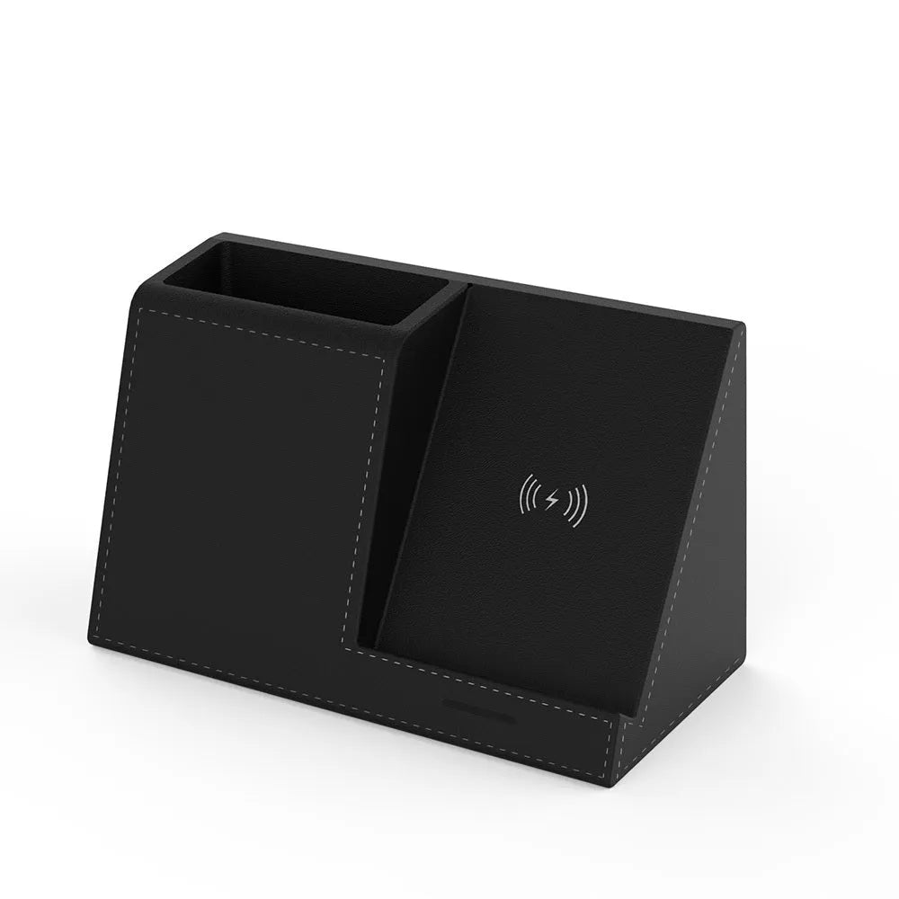 Black leather pen holder wireless charger on desk with phone charging and pens stored