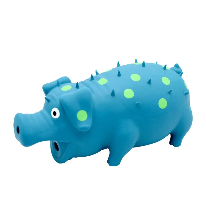 Latex pig-shaped dog chew toy in blue, green, orange, pink, purple, or yellow, with vocal system and teeth-grinding texture