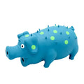 Latex pig-shaped dog chew toy in blue, green, orange, pink, purple, or yellow, with vocal system and teeth-grinding texture
