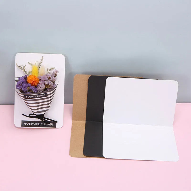 Kraft paper folded greeting cards in black, brown and white showing 10x15cm size