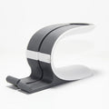 Grey desktop charging stand holding an Apple iPhone and an Apple Watch.