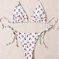 Solid colour women's halter bikini set with briefs and backless design.