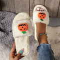 Halloween pumpkin plush slippers with open toe design showing synthetic fur uppers and PVC soles