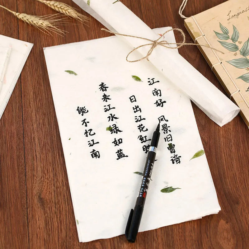 Ten sheets of Chinese ancient-style painting paper in green, red, and yellow designs, measuring 27.5 by 16.7 cm