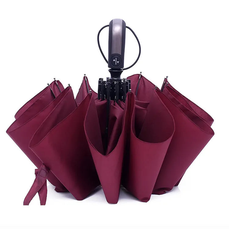 Black triple-folding automatic umbrella with 10 ribs showing palace-style shape and rubber handle