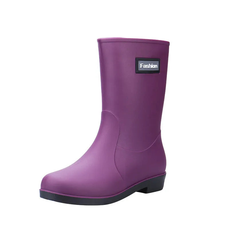 Women's PVC mid-calf rain boots in black, brown, apricot, and purple colours