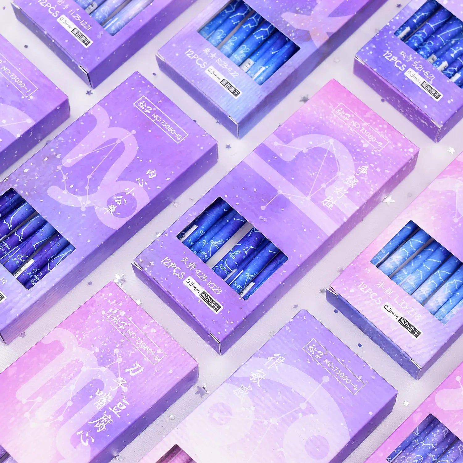 Box containing 12 constellation-themed plastic gel pens with quick-drying ink