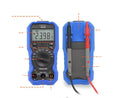 Handheld digital multimeter with LCD display, test leads, and NCV non-contact voltage sensor.