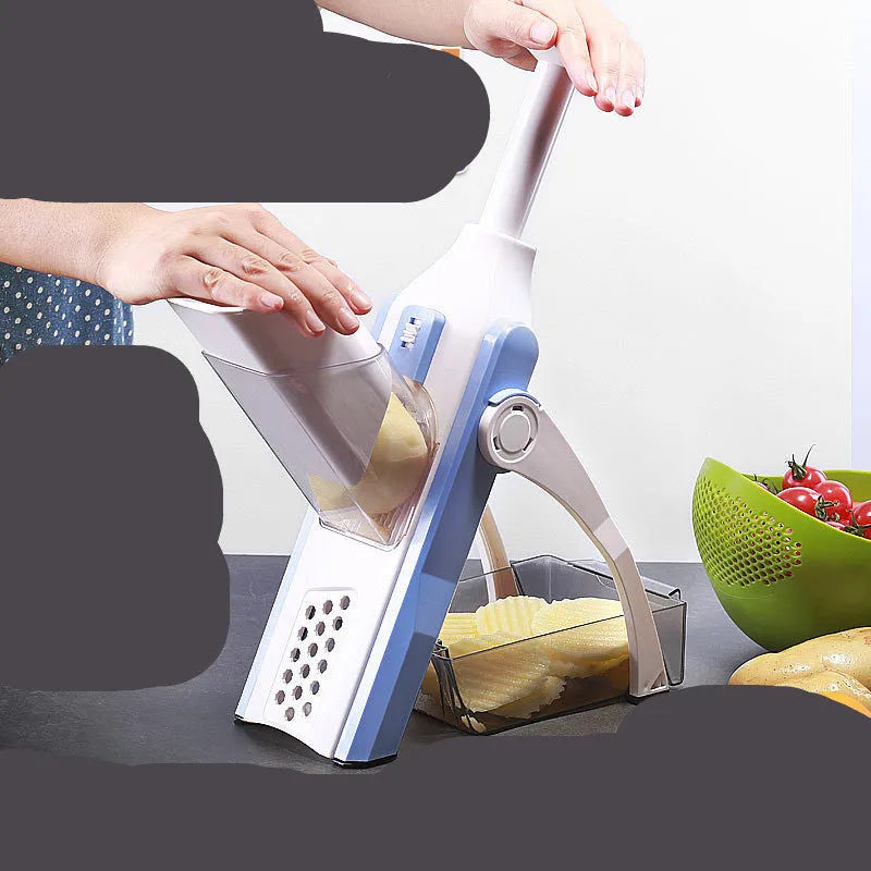 White and blue multifunctional vegetable slicer with stainless steel blades on kitchen counter