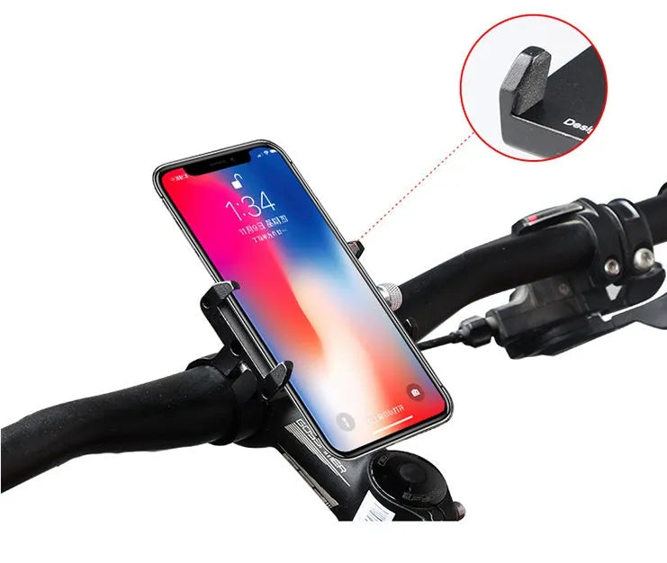 Black aluminium alloy GUB motorcycle phone holder mounted on bicycle handlebars, showing phone clamp.