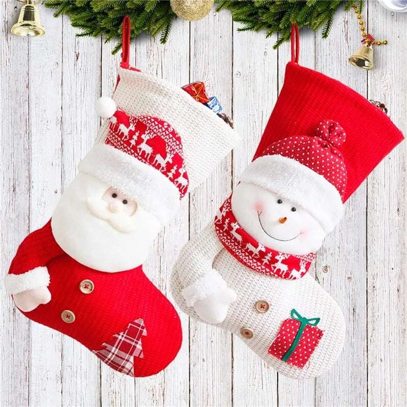 Large red white knitted Christmas stocking with Santa Claus design hanging above fireplace