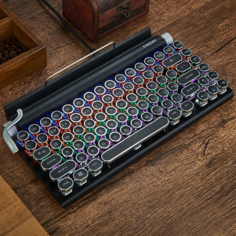 Black Dot retro typewriter mechanical keyboard with 83 keys, seven-colour backlight, and Bluetooth connectivity on a desk
