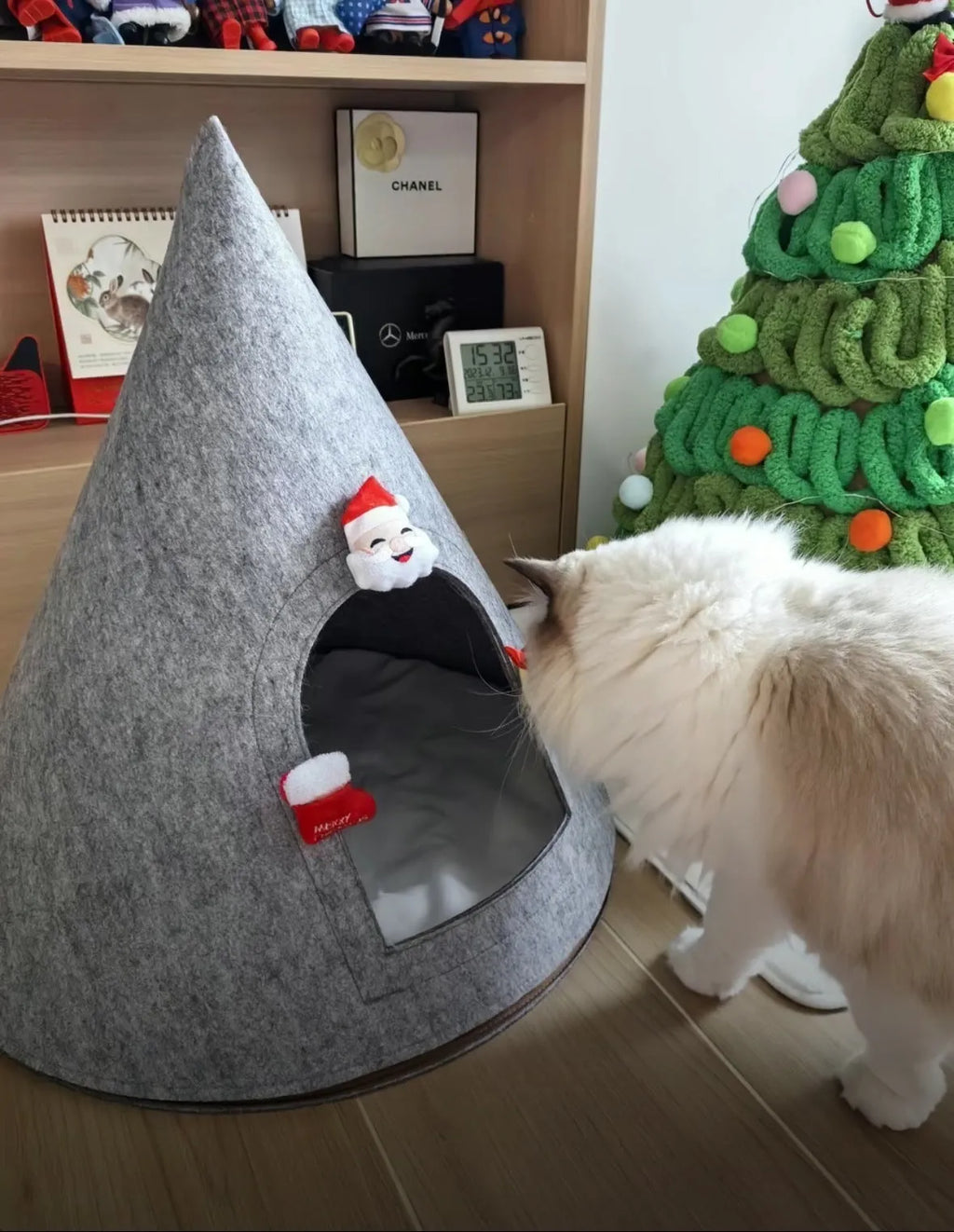 Grey conical felt cat house for indoor cats under 12 pounds.