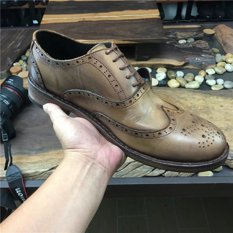Men's light brown vintage engraved handmade distressed leather shoes with lace-up closure and round toe