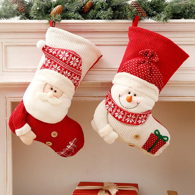 Large red white knitted Christmas stocking with Santa Claus design hanging above fireplace