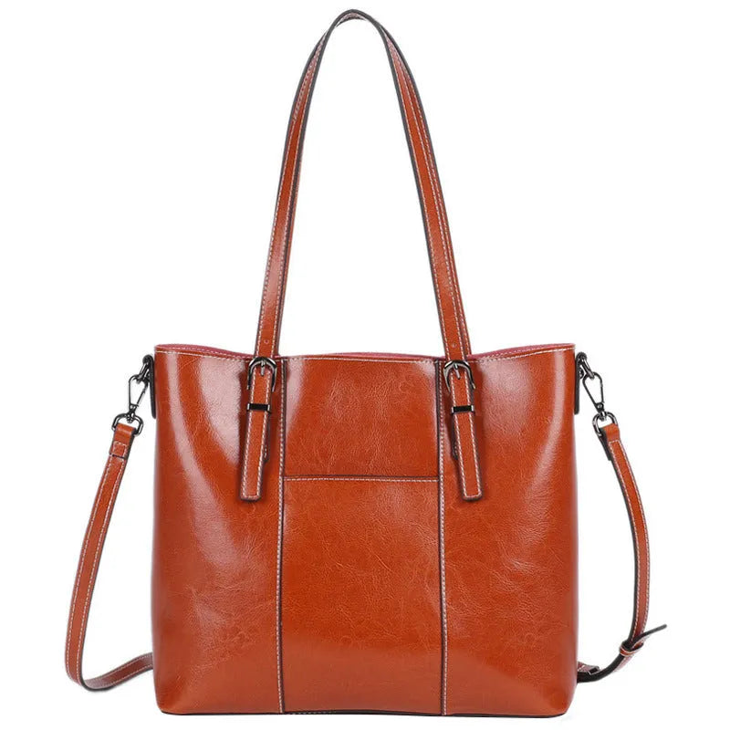 Brown genuine leather women's retro shoulder bag with three strap options and organised interior compartments