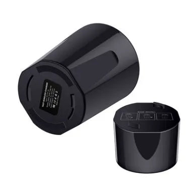 Black X9 car wireless charging cup and mount on a car dashboard with charging indicator light on.