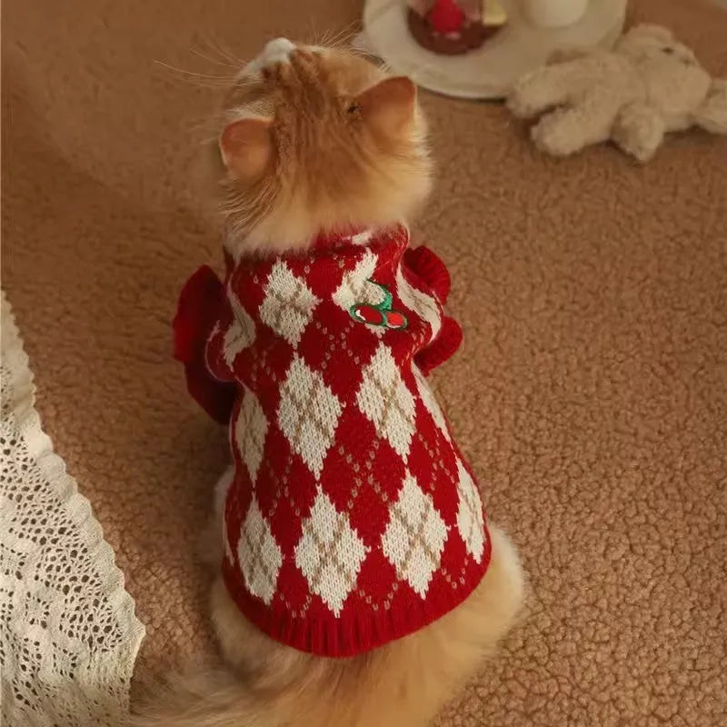 Red cat sweater with rhombic cherry embroidery for autumn and winter wear, shown in casual style