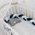 Baby crib bumper with braid knot design in spandex velvet, showing adjustable length protection around crib rails