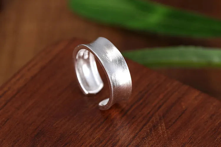 Geometric adjustable opening frosted sterling silver ring on finger