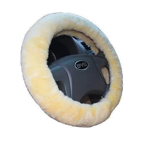 Wool and cashmere steering wheel cover and two long handle covers in a three-piece set on a car interior.