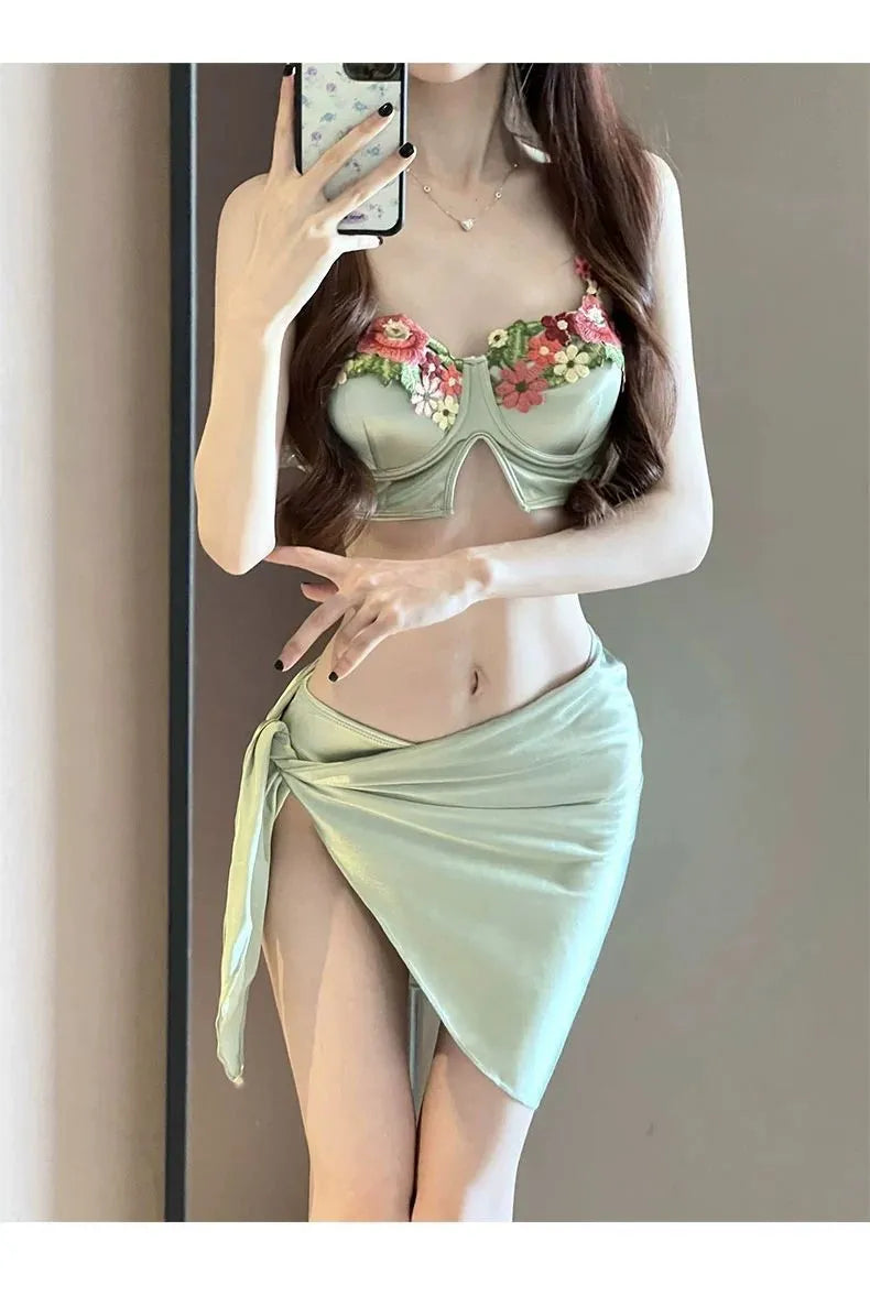 Green women's triangle bikini three-piece swimsuit set with matching skirt