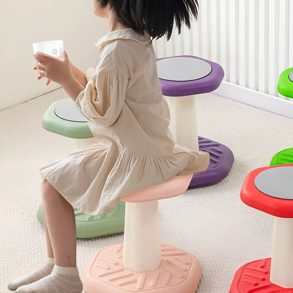 A plastic children's rocking stool for balance training and active sitting, shown in one of seven available colours.
