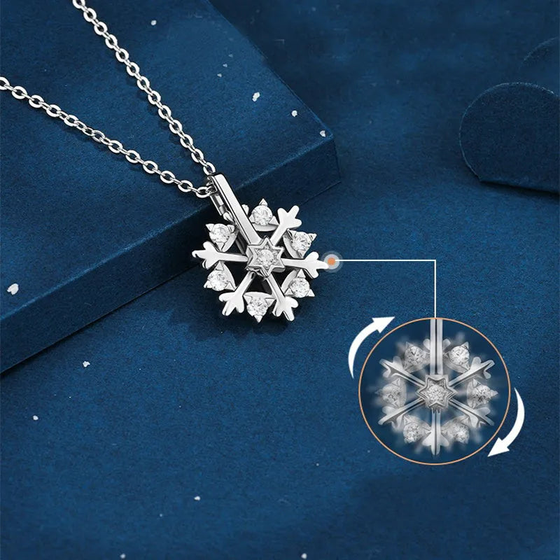 Rotatable S925 silver snowflake necklace for women with rhinestone detail, available in rose gold or white gold.