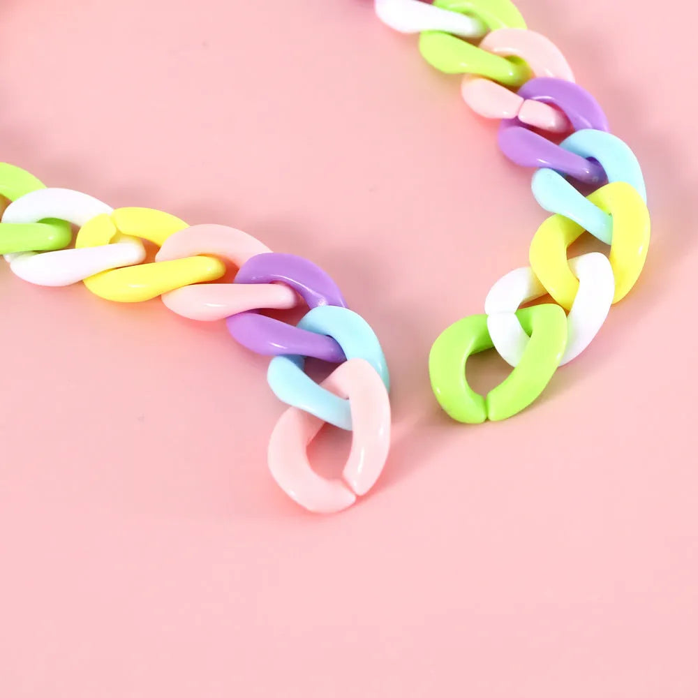 Adjustable pet collar in macaron candy colours with plastic construction and monochrome pattern