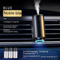 Obsidian black car vent clip aroma diffuser with essential oil bottle on a car air vent.