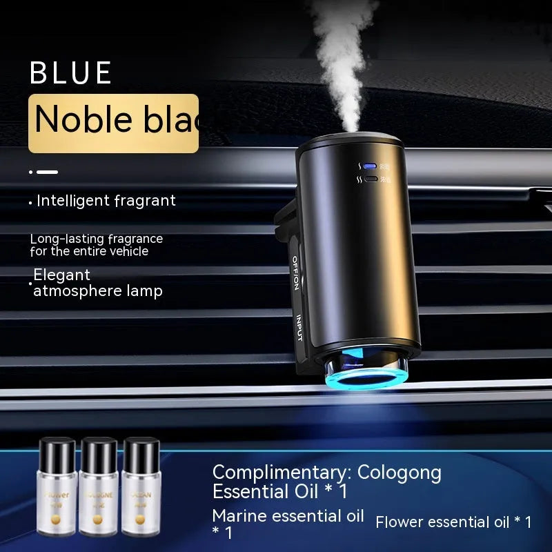 Obsidian black car vent clip aroma diffuser with essential oil bottle on a car air vent.