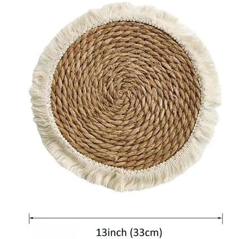 Round Japanese straw placemat with decorative tassels in natural papyrus colour, showing handwoven texture