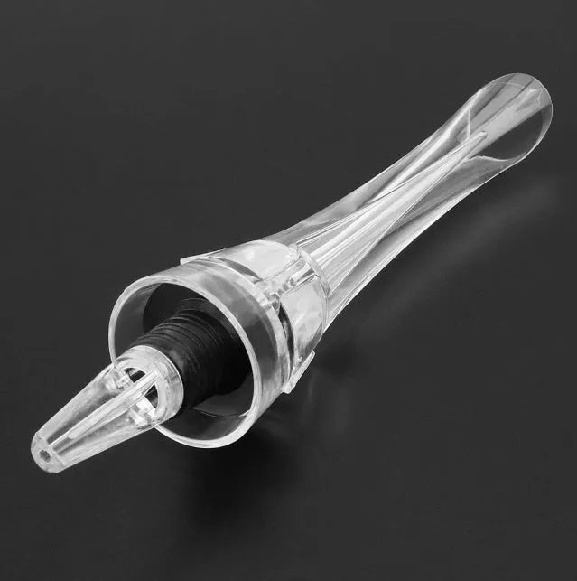 Wine aerator with stainless steel filter, measuring 16cm in length and 4.2cm in diameter, on a glass with red wine.