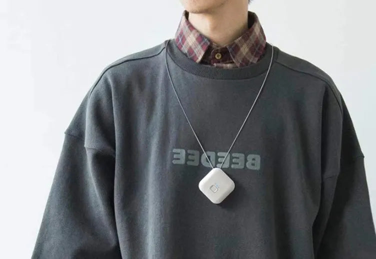 USB mini portable air purifier necklace in blue, showing compact design with USB charging port