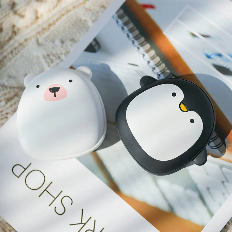 Cartoon penguin polar bear design USB hand warmer showing double-side heating and compact 83x78x35mm dimensions