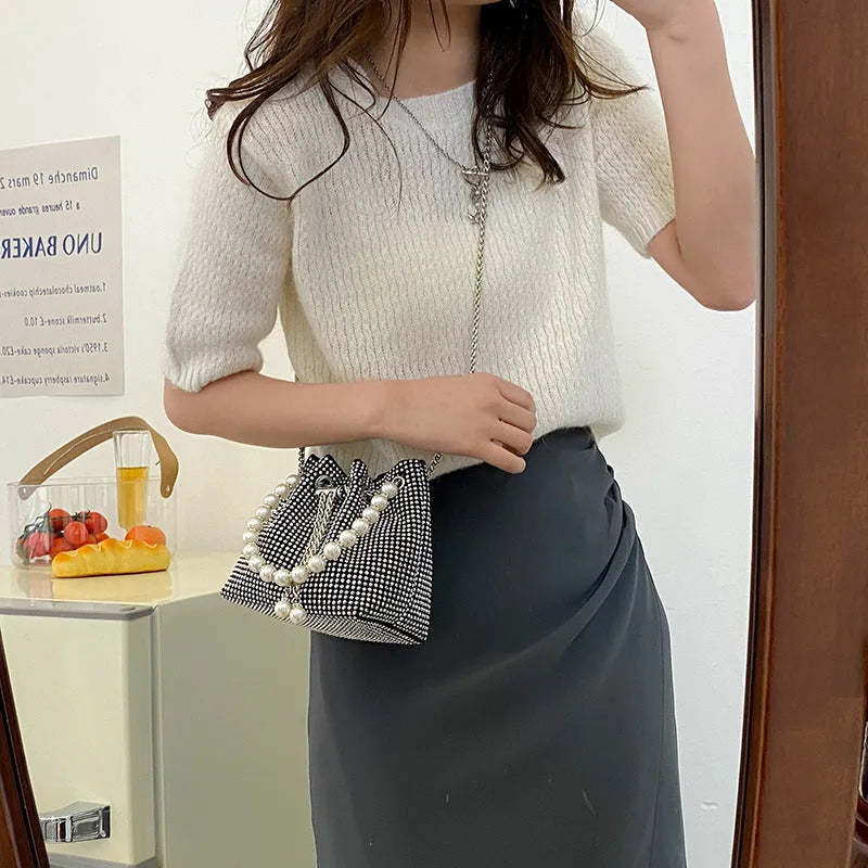 Light diamond shoulder crossbody bag with chain strap and bucket shape in soft PU.