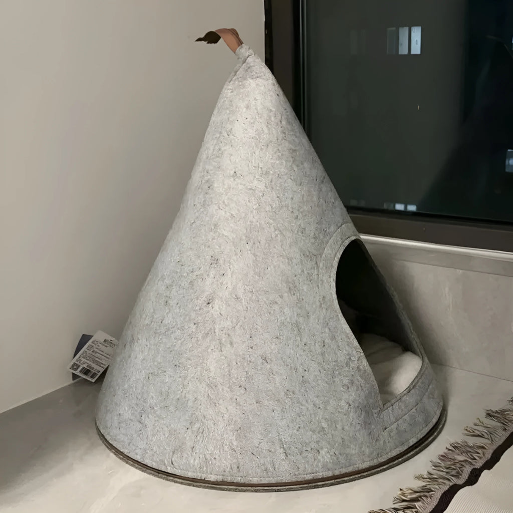 Grey conical felt cat house for indoor cats under 12 pounds.