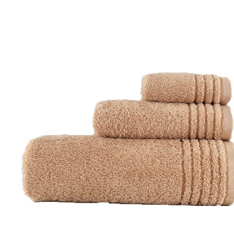 Cotton towel set in brown showing three sizes: large bath sheet, standard bath towel and small hand towel