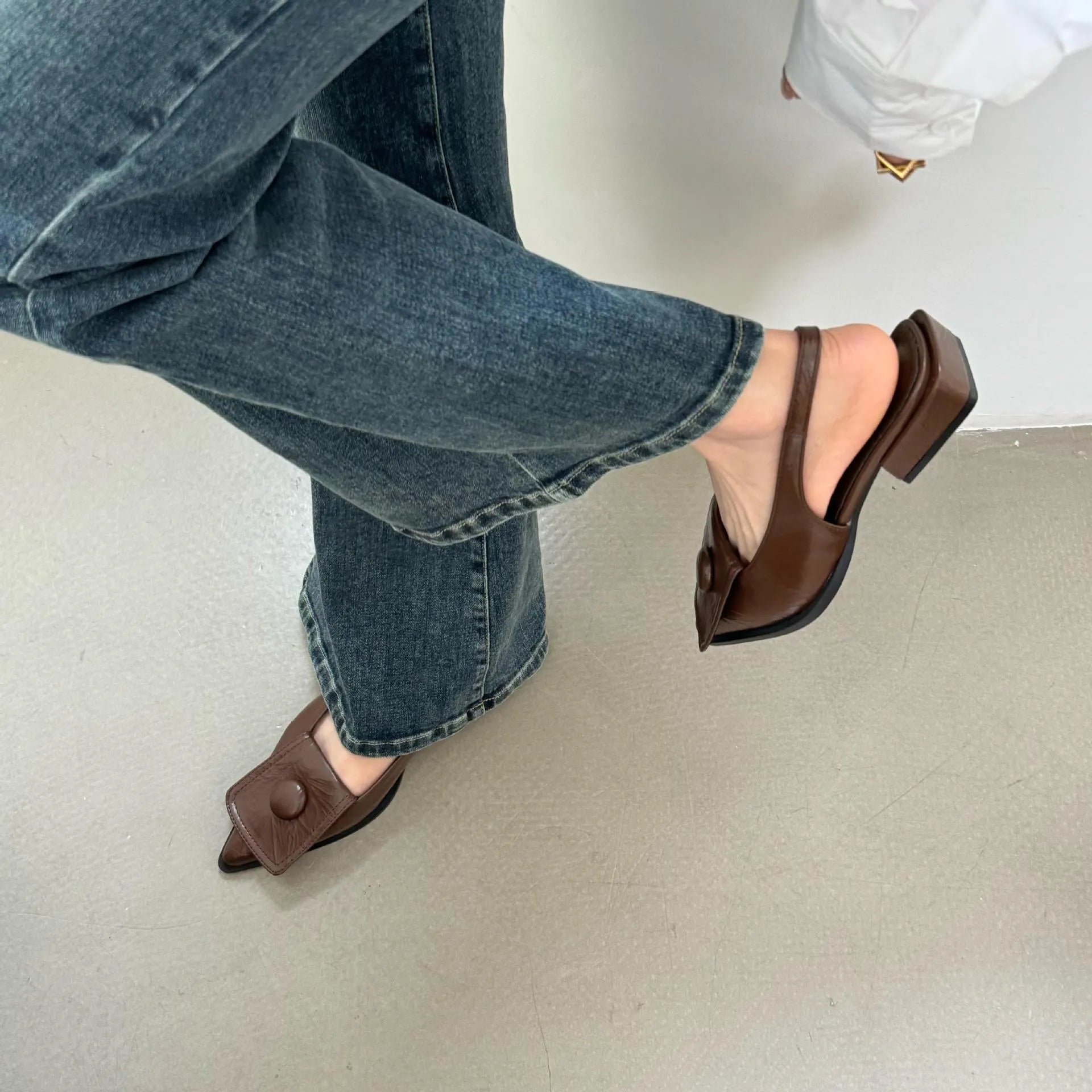 Women's low heel sandals with pointed closed toe and back strap in apricot colour