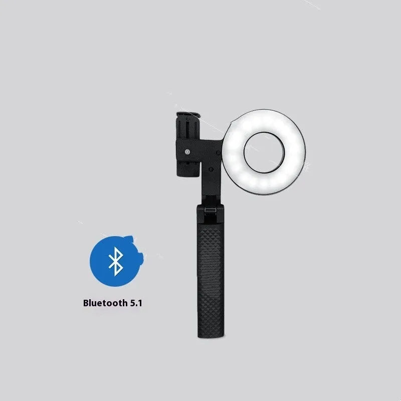 Black handheld LED fill light for smartphone photography with compact rectangular design