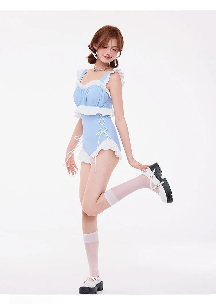 Light blue women's one-piece swimsuit with lace detail, high waist, backless design, and small chest gather.