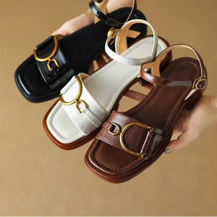 Women's black thick-soled casual sandals with a round toe and press-stud fastening.