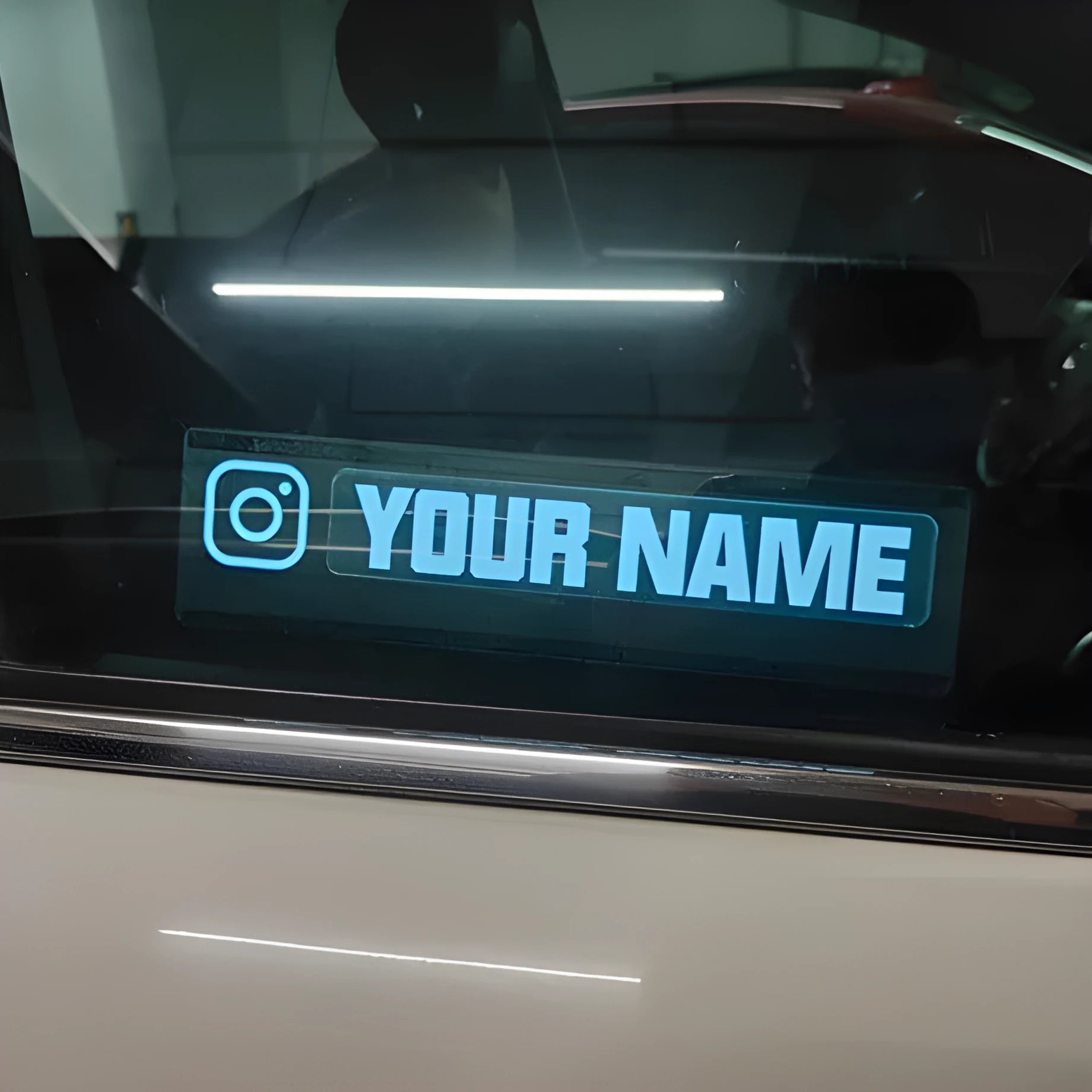 Electroluminescent car window sticker with foundation white glow on vehicle glass