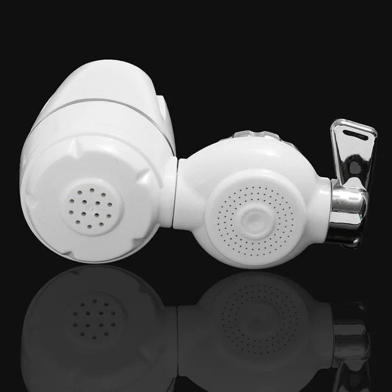 White plastic faucet water filter with universal adapter kit and ceramic cartridge on a kitchen tap.