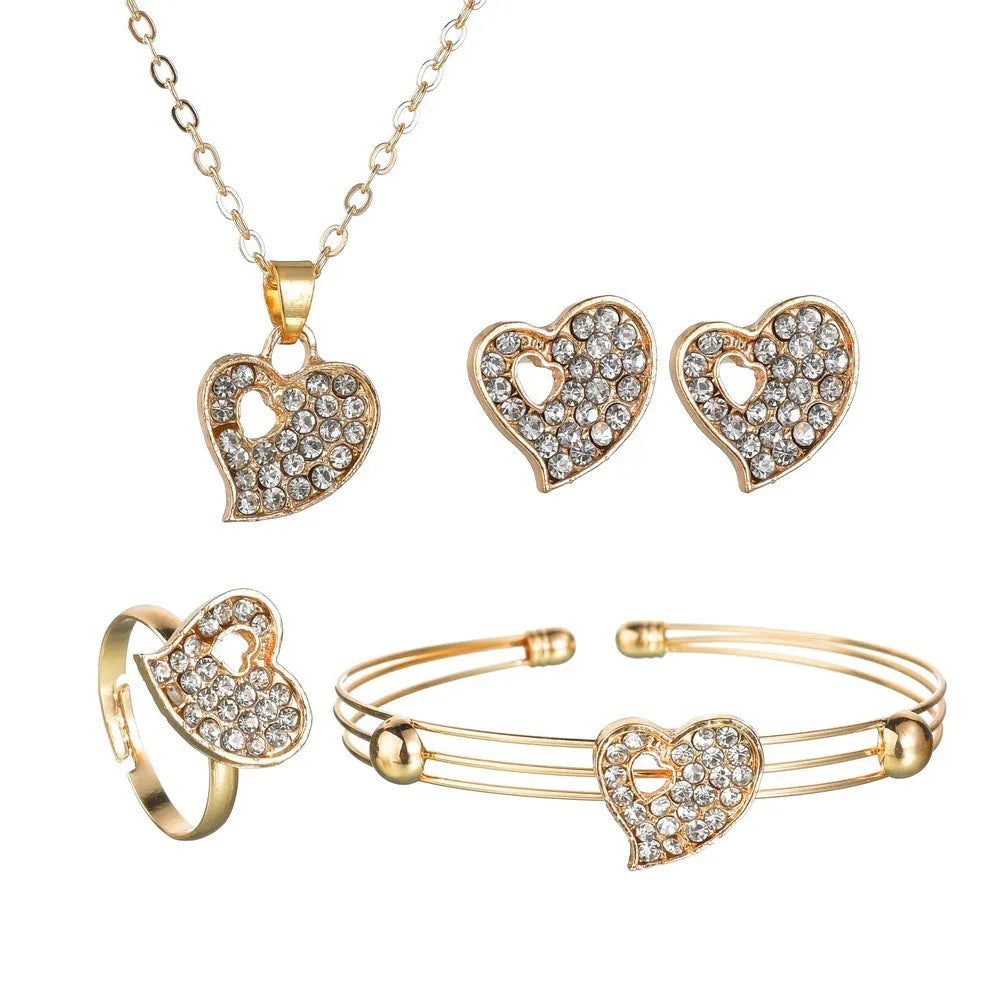 Gold electroplated alloy women's jewellery set with love, water drop, and bell patterned earrings, pendant, and bracelet.