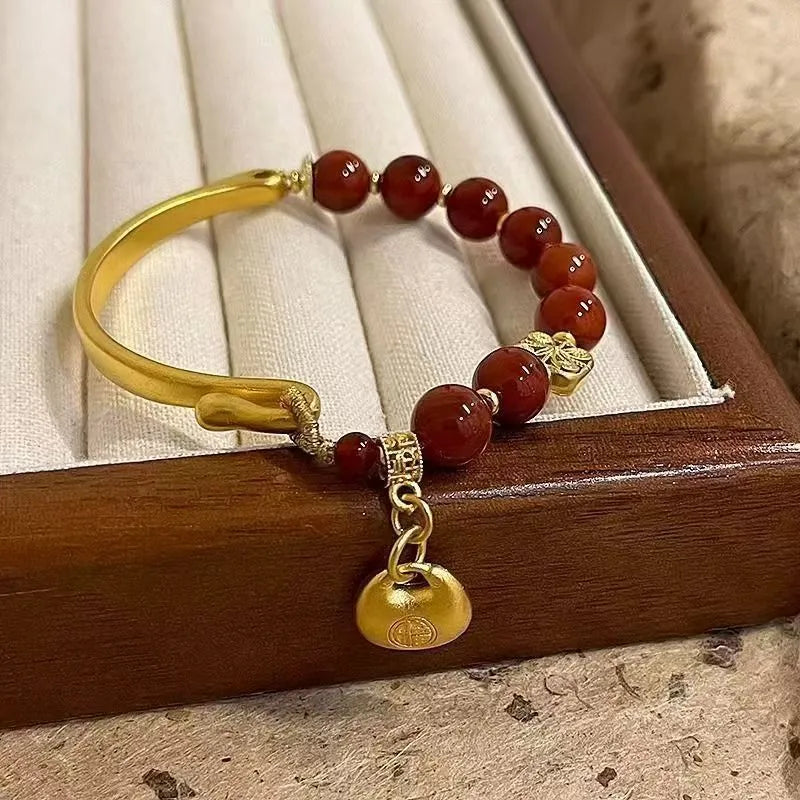 Golden Southern Red Agate character ingot bracelet with antique design on wrist