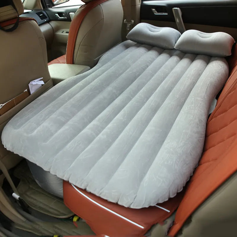 Black wave colour inflatable car bed with two pillows on a car seat