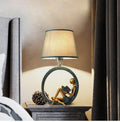 Blue reading girl table lamp in resin and cloth, 20 x 39.8cm, E27 fitting, for bedside or desk use